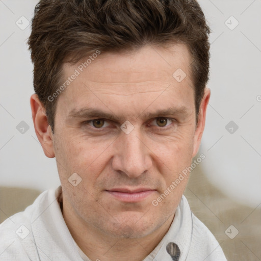 Joyful white adult male with short  brown hair and grey eyes