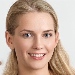 Joyful white young-adult female with long  brown hair and blue eyes