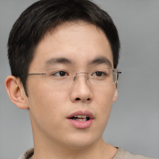 Neutral asian young-adult male with short  brown hair and brown eyes