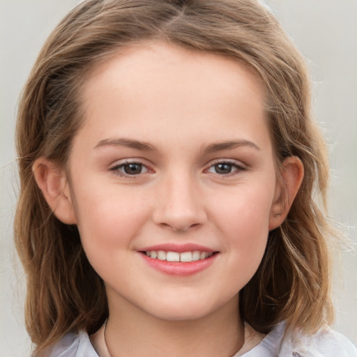 Joyful white child female with medium  brown hair and brown eyes