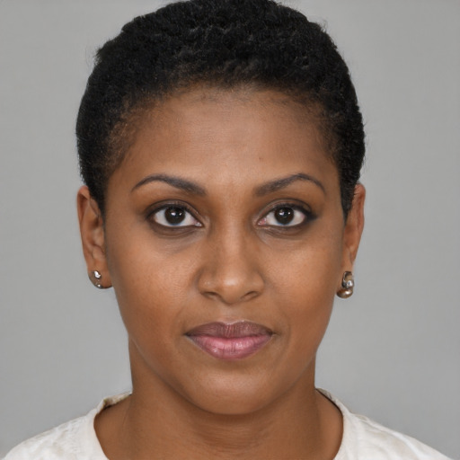 Joyful black young-adult female with short  brown hair and brown eyes