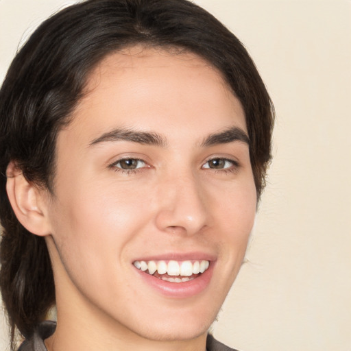 Joyful white young-adult male with medium  brown hair and brown eyes