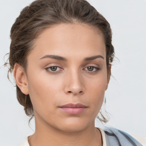 Neutral white young-adult female with medium  brown hair and brown eyes