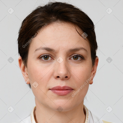 Joyful white young-adult female with short  brown hair and grey eyes