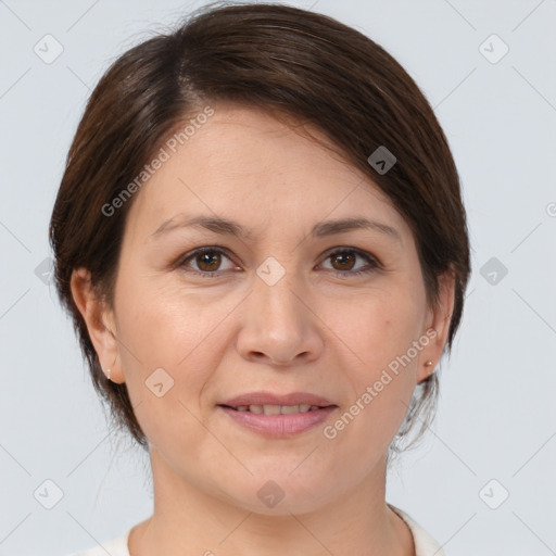 Joyful white adult female with medium  brown hair and brown eyes