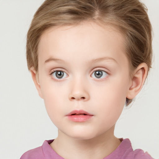 Neutral white child female with short  brown hair and grey eyes