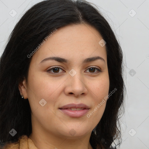 Joyful latino young-adult female with long  brown hair and brown eyes