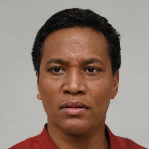 Neutral latino adult male with short  black hair and brown eyes