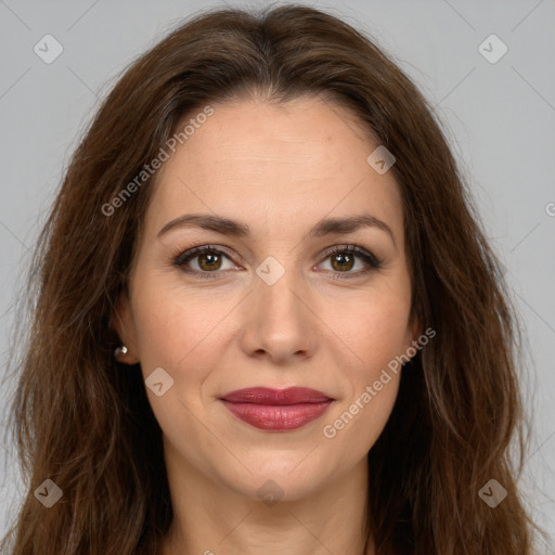 Joyful white adult female with long  brown hair and brown eyes