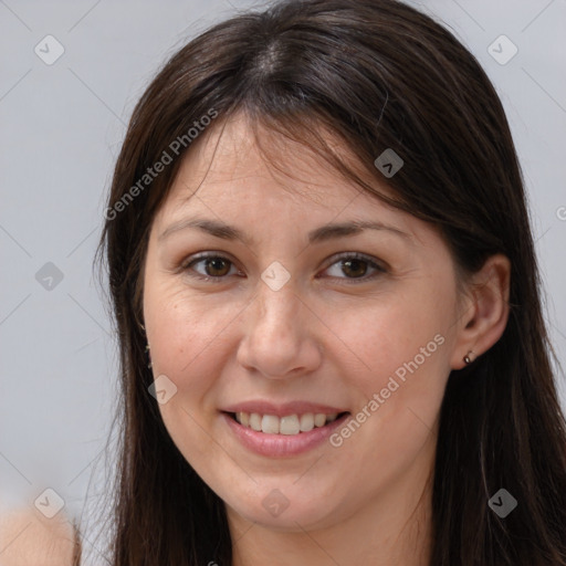 Joyful white young-adult female with long  brown hair and brown eyes