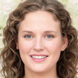 Joyful white young-adult female with long  brown hair and green eyes