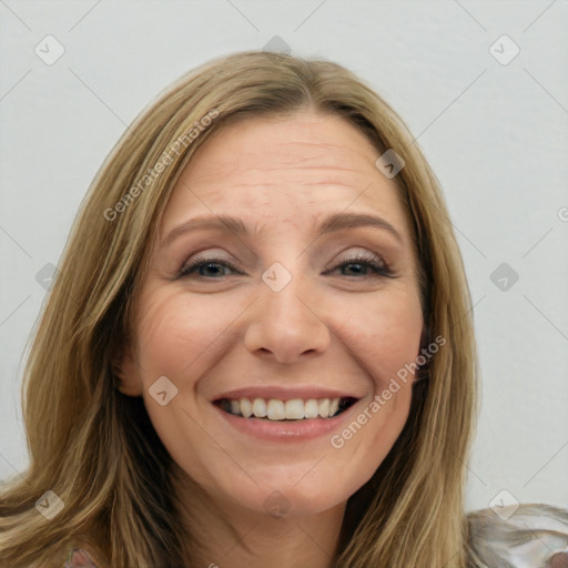 Joyful white young-adult female with long  brown hair and blue eyes