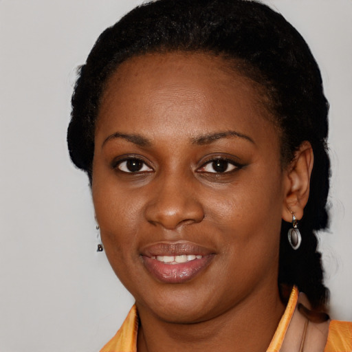 Joyful black young-adult female with short  black hair and brown eyes