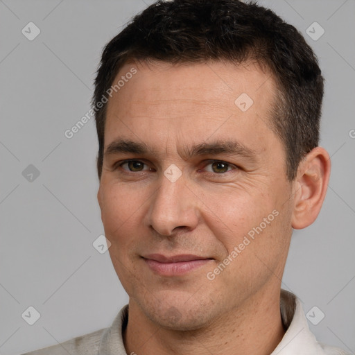 Joyful white adult male with short  brown hair and brown eyes