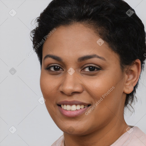 Joyful latino young-adult female with short  brown hair and brown eyes