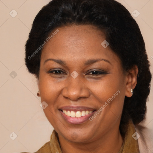 Joyful black adult female with short  brown hair and brown eyes