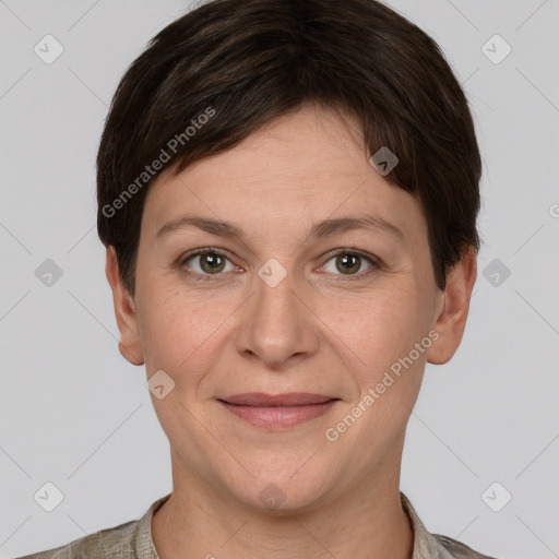 Joyful white adult female with short  brown hair and grey eyes