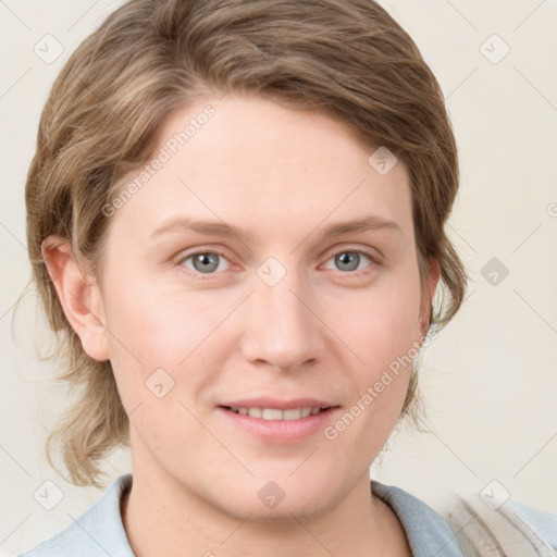 Joyful white young-adult female with medium  brown hair and blue eyes