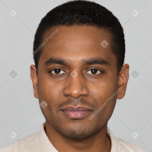Joyful black young-adult male with short  black hair and brown eyes