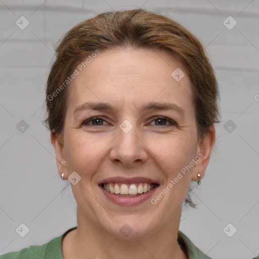 Joyful white adult female with short  brown hair and grey eyes