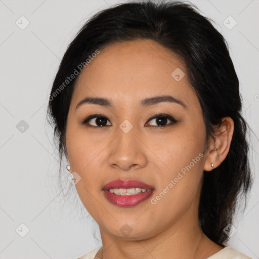 Joyful asian young-adult female with medium  black hair and brown eyes