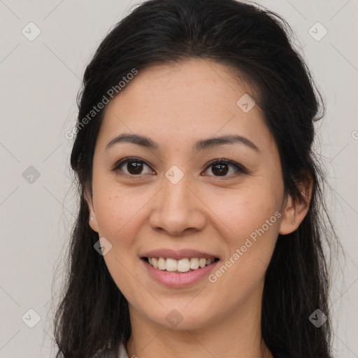 Joyful latino young-adult female with long  brown hair and brown eyes