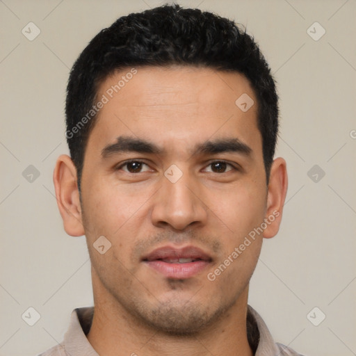 Joyful latino young-adult male with short  black hair and brown eyes