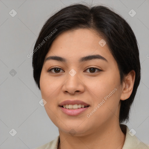 Joyful asian young-adult female with medium  black hair and brown eyes