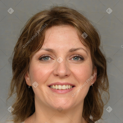 Joyful white adult female with medium  brown hair and green eyes