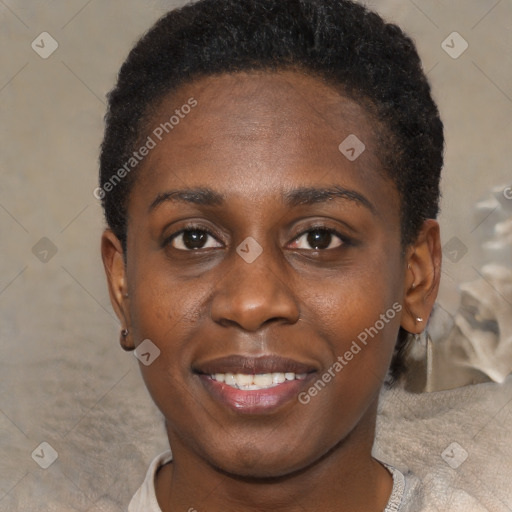 Joyful black young-adult female with short  brown hair and brown eyes