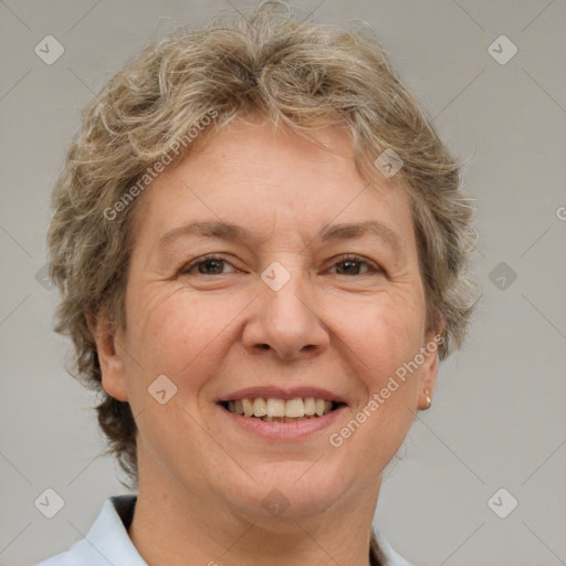 Joyful white adult female with short  brown hair and brown eyes