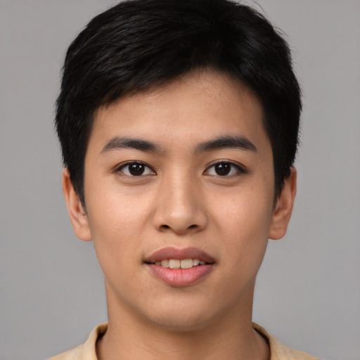 Joyful asian young-adult male with short  black hair and brown eyes