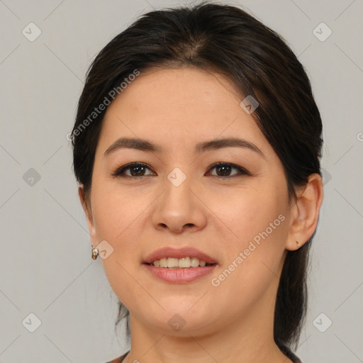 Joyful asian young-adult female with medium  brown hair and brown eyes