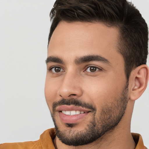 Joyful white young-adult male with short  brown hair and brown eyes