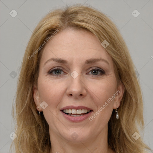 Joyful white adult female with long  brown hair and brown eyes