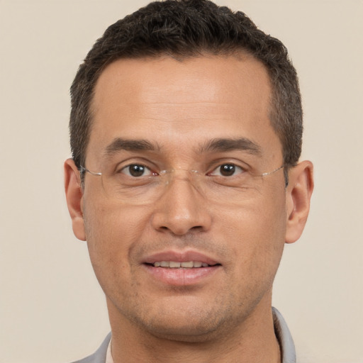 Joyful white adult male with short  brown hair and brown eyes