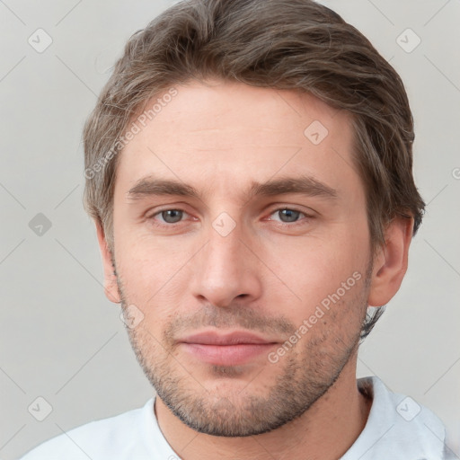 Neutral white young-adult male with short  brown hair and grey eyes