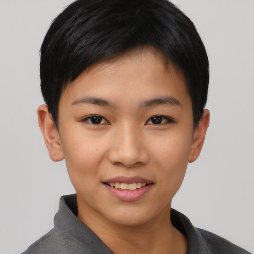 Joyful asian young-adult female with short  black hair and brown eyes