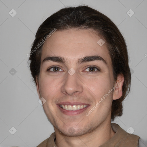 Joyful white young-adult male with medium  brown hair and brown eyes