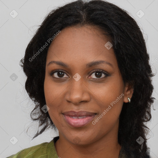 Joyful black young-adult female with long  black hair and brown eyes