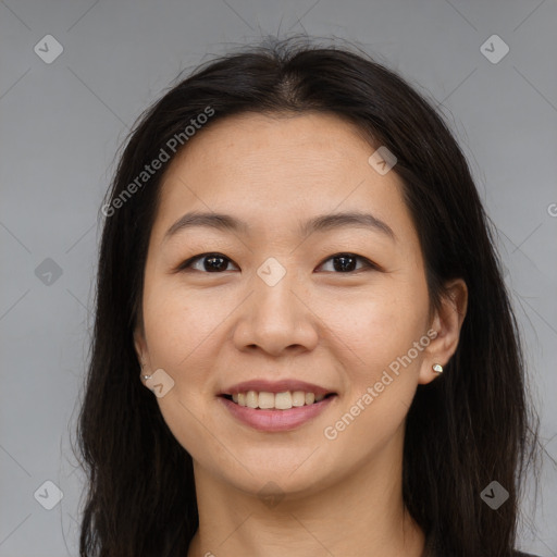 Joyful asian young-adult female with long  brown hair and brown eyes