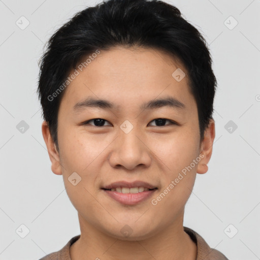 Joyful asian young-adult male with short  brown hair and brown eyes