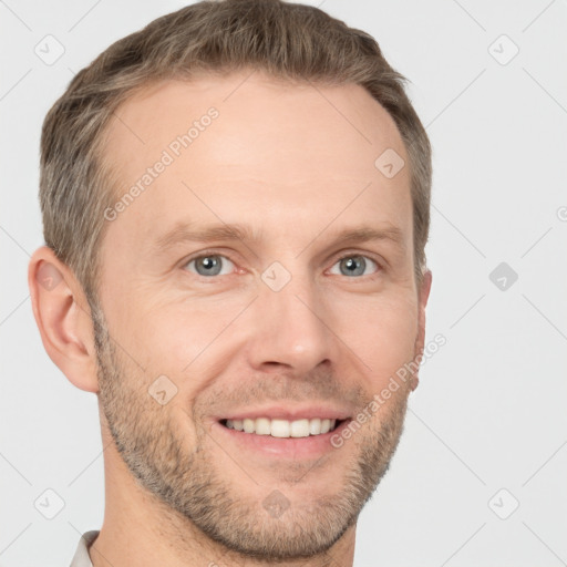 Joyful white adult male with short  brown hair and grey eyes