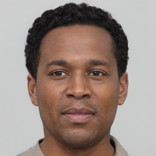 Neutral latino young-adult male with short  brown hair and brown eyes