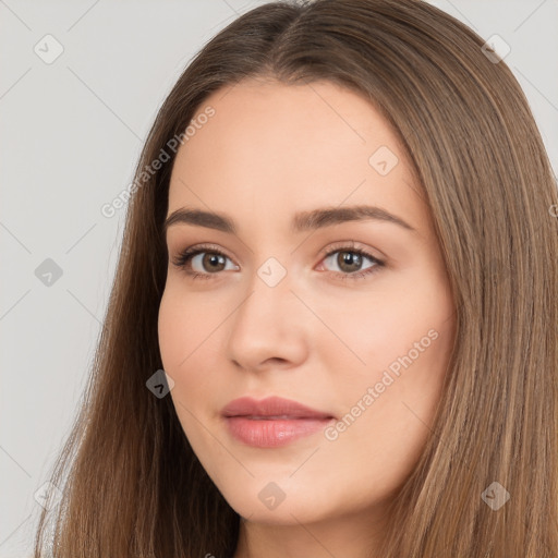 Neutral white young-adult female with long  brown hair and brown eyes