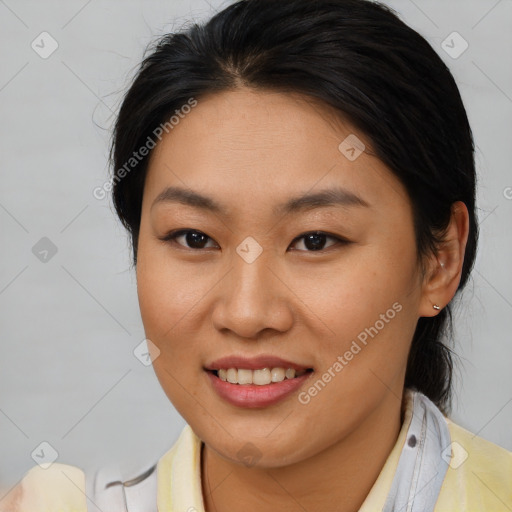 Joyful asian young-adult female with medium  brown hair and brown eyes