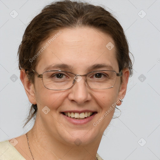 Joyful white adult female with short  brown hair and grey eyes