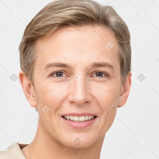 Joyful white adult male with short  brown hair and grey eyes