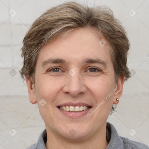 Joyful white adult male with short  brown hair and grey eyes