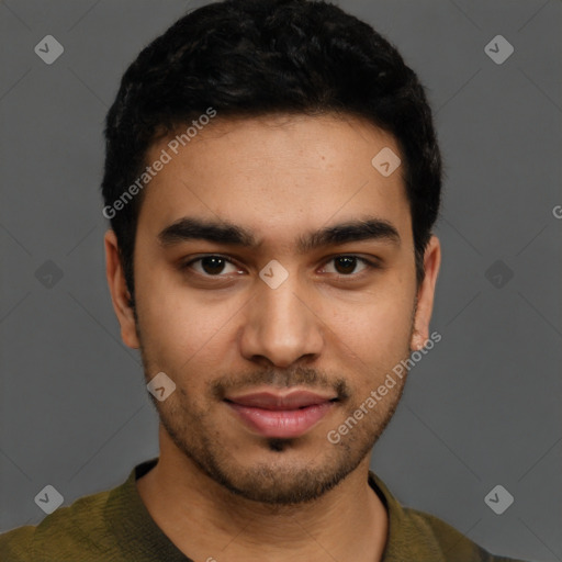 Joyful latino young-adult male with short  brown hair and brown eyes